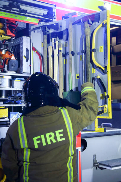 istock Firefighter taking equipment from fire truck 1053546494