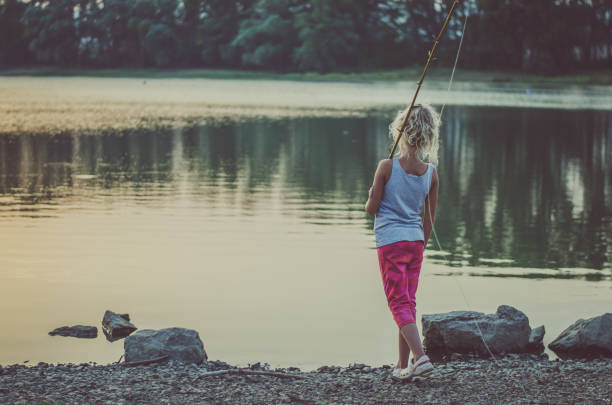 istock child fishing at the pond 1053547568