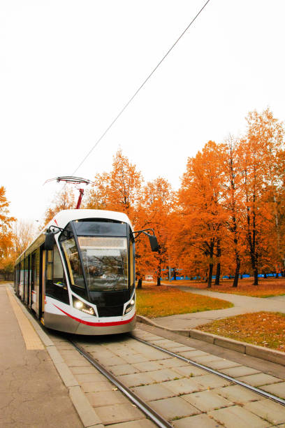 istock public transport, modern city tram, approaching the bus stop 1053549502