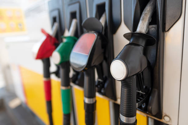 istock Petrol pump filling nozzles 1053553620