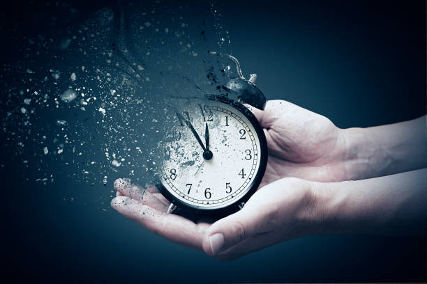 istock Concept of passing away, the clock breaks down into pieces 1053553756