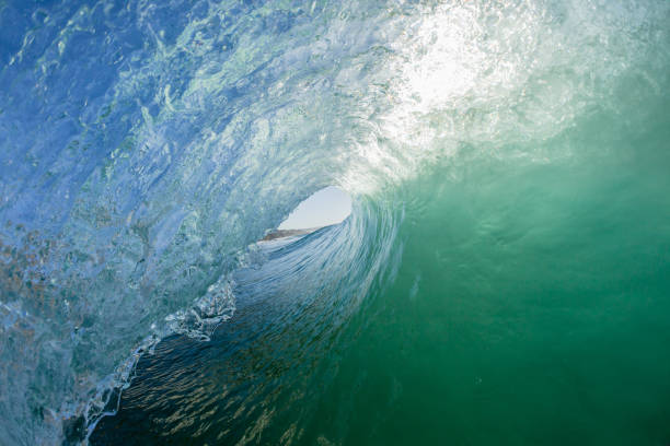 istock Wave Surfers Tube Ride 1053553924