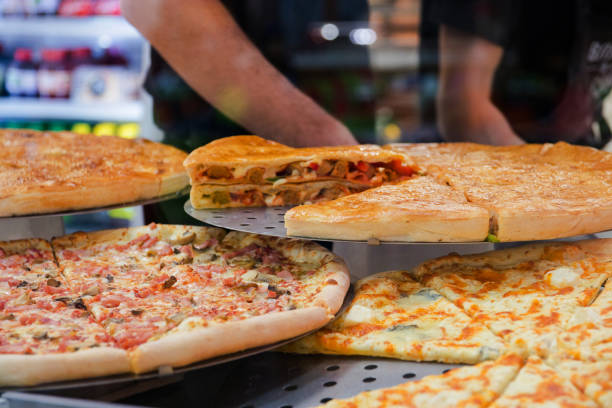 istock various pizza on a show-window in cafe with various ingredients 1053554024