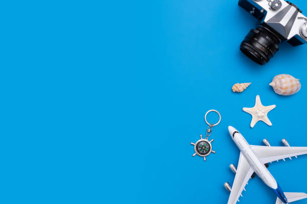 istock Summer Travel accessories on blue background 1053554196