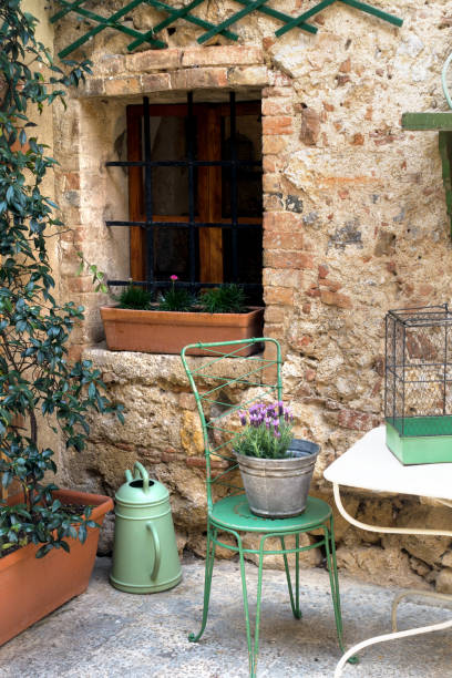 istock Small patio with tables and chairs. Italy