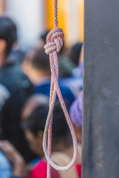 Hanging Noose with people at the background Hanging Noose with the People at the background. Hanging Rope . untie-rope stock pictures, royalty-free photos & images