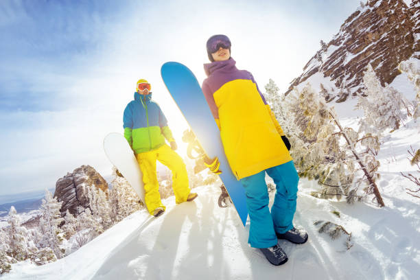 istock Two snowboarders at off-piste ski slope 1053559792