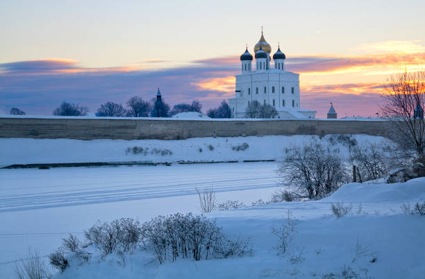 Sunrise winter view of ancient Trinity Cathedral in Pskov, Russia across river Sunrise winter view of ancient Trinity Cathedral in Pskov, Russia. Cathedral is a place of worship pskov city stock pictures, royalty-free photos & images