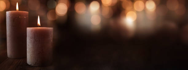 istock Dark christmas bokeh background with candles 1053578028
