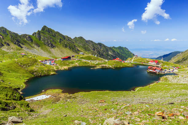 Balea lake, Romania. Romania. Balea Lake and Fagaras mountains in the summer. balea lake romania stock pictures, royalty-free photos & images