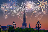 Night view of  Eiffel Tower with fireworks in Paris, France.