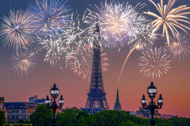 Night view of  Eiffel Tower with fireworks in Paris, France. Night view of  Eiffel Tower with fireworks in Paris, France. champ de mars stock pictures, royalty-free photos & images