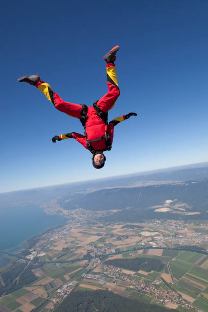 istock Sky diver falls towards rural area 1053590664