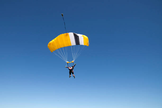 istock Paraglider glides over the Swiss Alps 1053590720