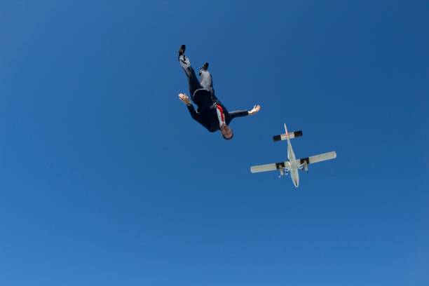 istock Sky diver falls from plane, in business suit 1053590824