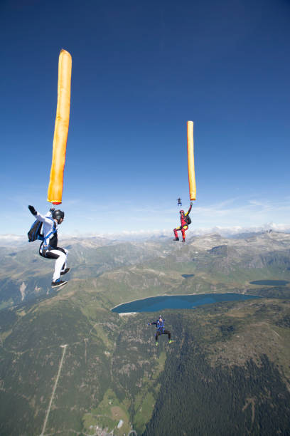 istock Sky divers fall with balloons over Alps 1053591082