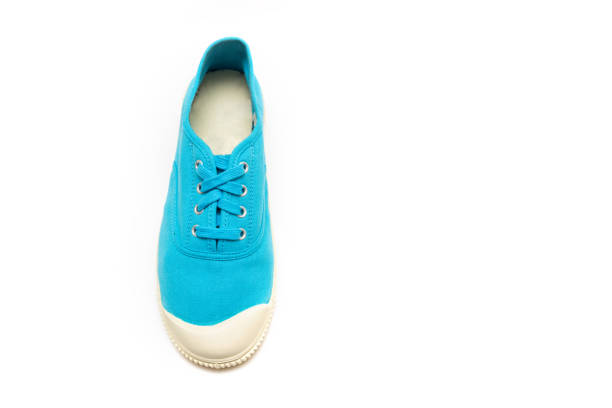 istock bright blue sneakers on a white background, gumshoes