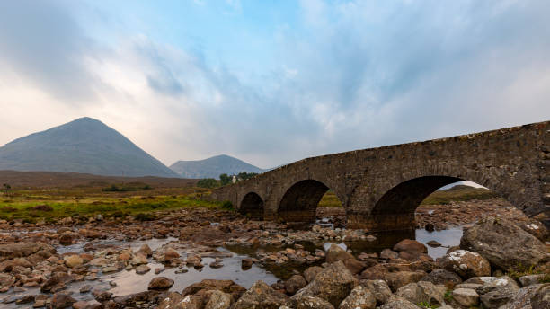 istock The old Sligachan bridge with Black Cuillin Mountains in background and low hanging clouds, Isle of Skye, Scotland 1053597710