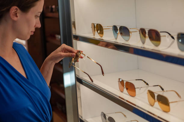 istock Woman shopping for sunglasses 1053598416