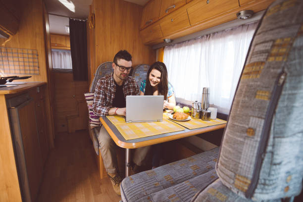 istock Couple on road trip with campervan 1053599970