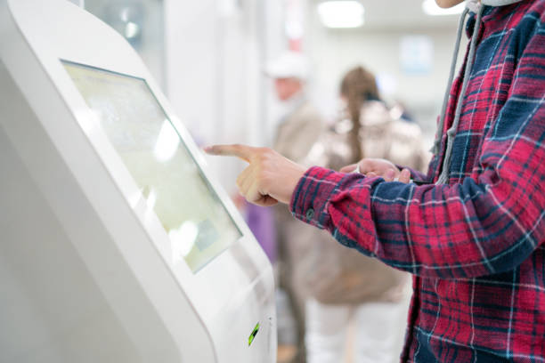 close up person using touch screen panel in post office to recieve a package f - plant stand imagens e fotografias de stock