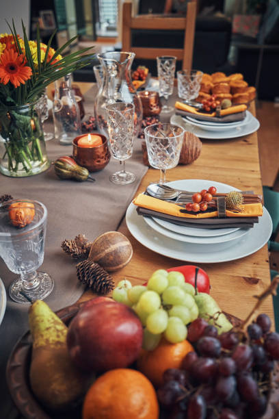 istock Decorated Table for Thanksgiving Dinner with Candles, Pumpkins, Leafs and Nuts 1053603914