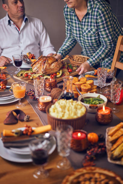 istock Family Having Traditional Holiday Stuffed Turkey Dinner 1053603938