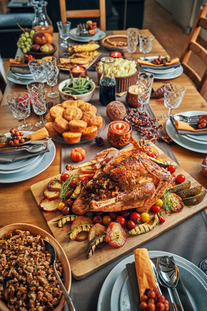 istock Family Having Traditional Holiday Stuffed Turkey Dinner 1053603942