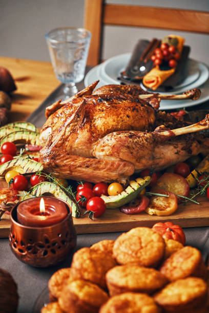 istock Family Having Traditional Holiday Stuffed Turkey Dinner 1053603948
