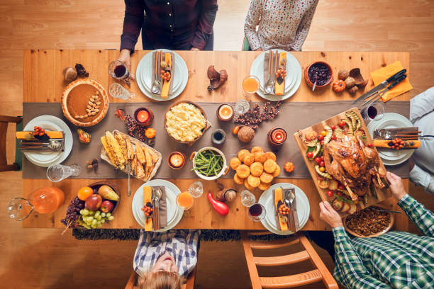 istock Family Having Traditional Holiday Stuffed Turkey Dinner 1053603996