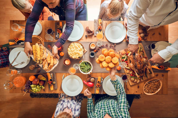 istock Family Having Traditional Holiday Stuffed Turkey Dinner 1053604002
