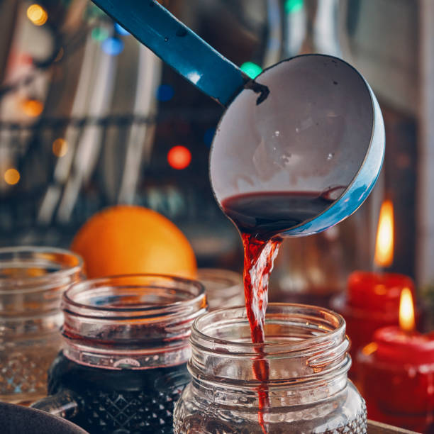 istock Preparing Mulled Wine with Orange, Cinnamon, Star Anise and Spices for Christmas 1053604468