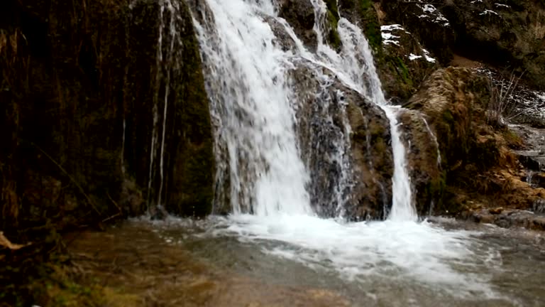 small waterfall like a background, a backdrop or wallpaper.