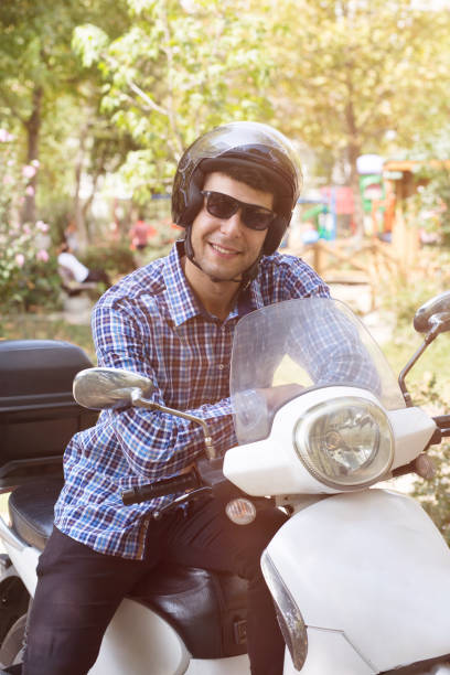 istock Handsome Biker man sits on a bike. 1053610770