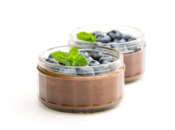 istock Chocolate  praline mousse with berries isolated on white 1053613606