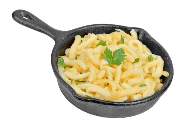 Spaetzle in a pan on white background stock photo
