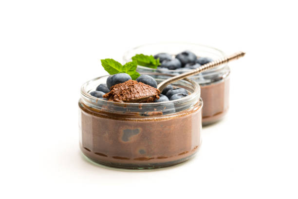 istock Chocolate  praline mousse with berries isolated on white 1053613896