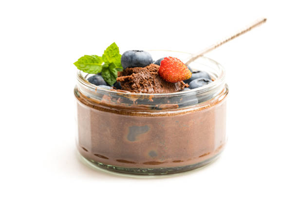 istock Chocolate  praline mousse with berries isolated on white 1053614356