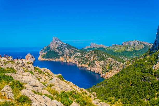 istock People are enjoying view from Es Colomer viewpoint, Mallorca, Spain 1053614438