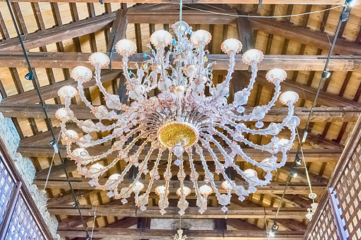 Magnificent murano glass chandelier, Murano, Venice, Italy. The island is a popular attraction for tourists, famous for its glass making