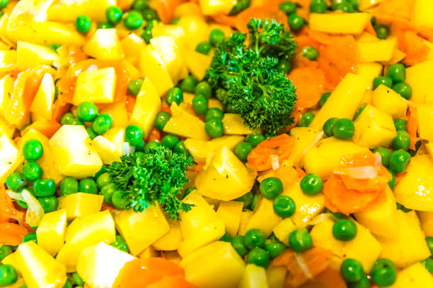 Dish of healthy vegetables - peas, cellery, carrots.