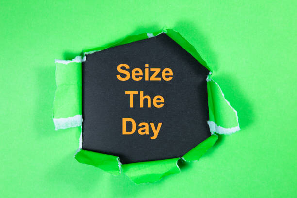 istock Seize The Day text on paper. Word Seize The Day on torn paper. Concept Image. 1053627254
