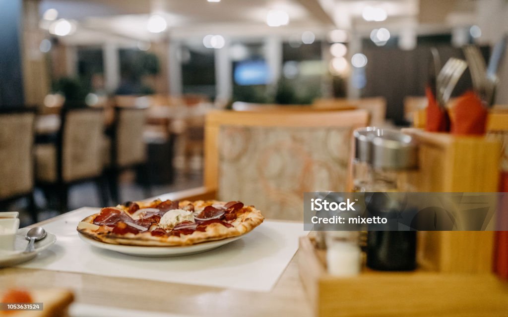 Mizza on the table in a restaurant Photo of pizza on the table in a restaurant Pizzeria Stock Photo