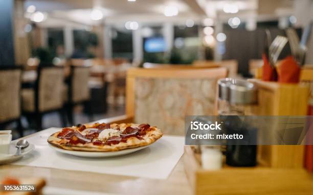 Mizza On The Table In A Restaurant Stock Photo - Download Image Now - Pizzeria, Cafe, Day