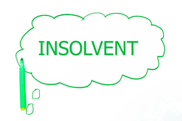 INSOLVENT word written with marker