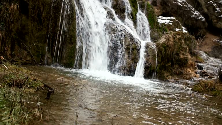 small waterfall like a background, a backdrop or wallpaper.