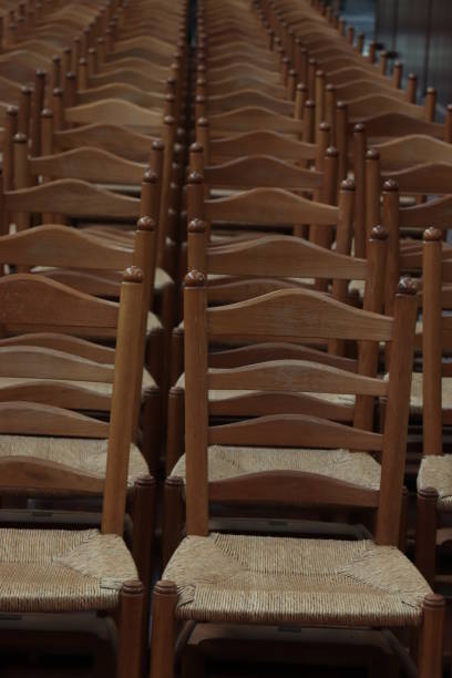 istock Wooden chairs in a church 1053642688