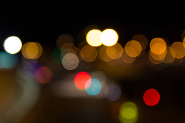 istock Abstract Light Bokeh Background. Defocused night traffic lights 1053645454