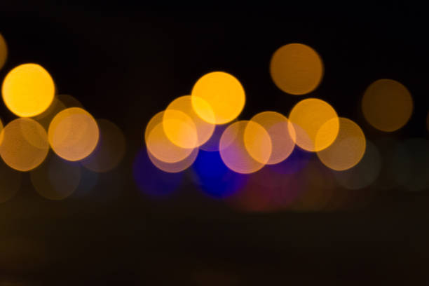 istock Abstract Light Bokeh Background. Defocused night traffic lights 1053645896