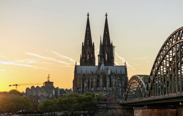 istock View on Cologne Cathedral and Hohenzollern Bridge, Germany. october 2018 1053646332